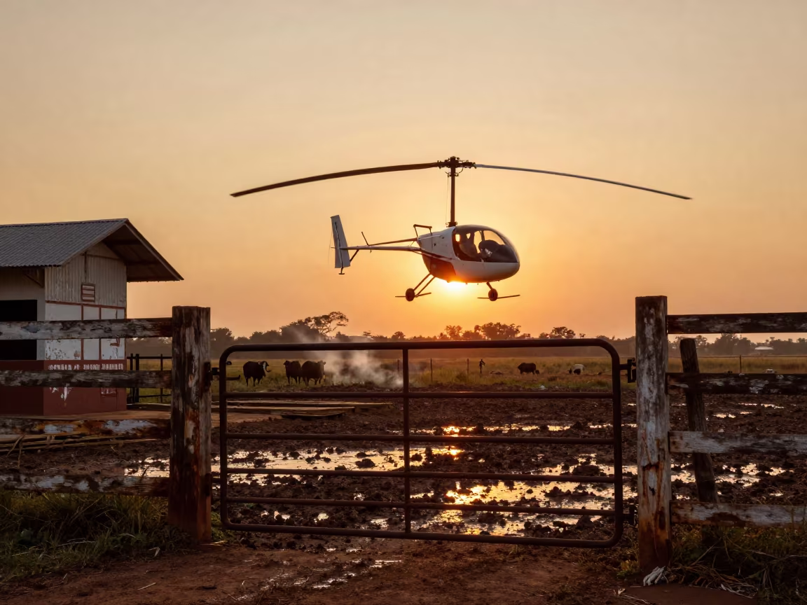 Gyrocopter Over Venezuelan Cattle Station Sunset in along a muddy paddock fence in Venezuela