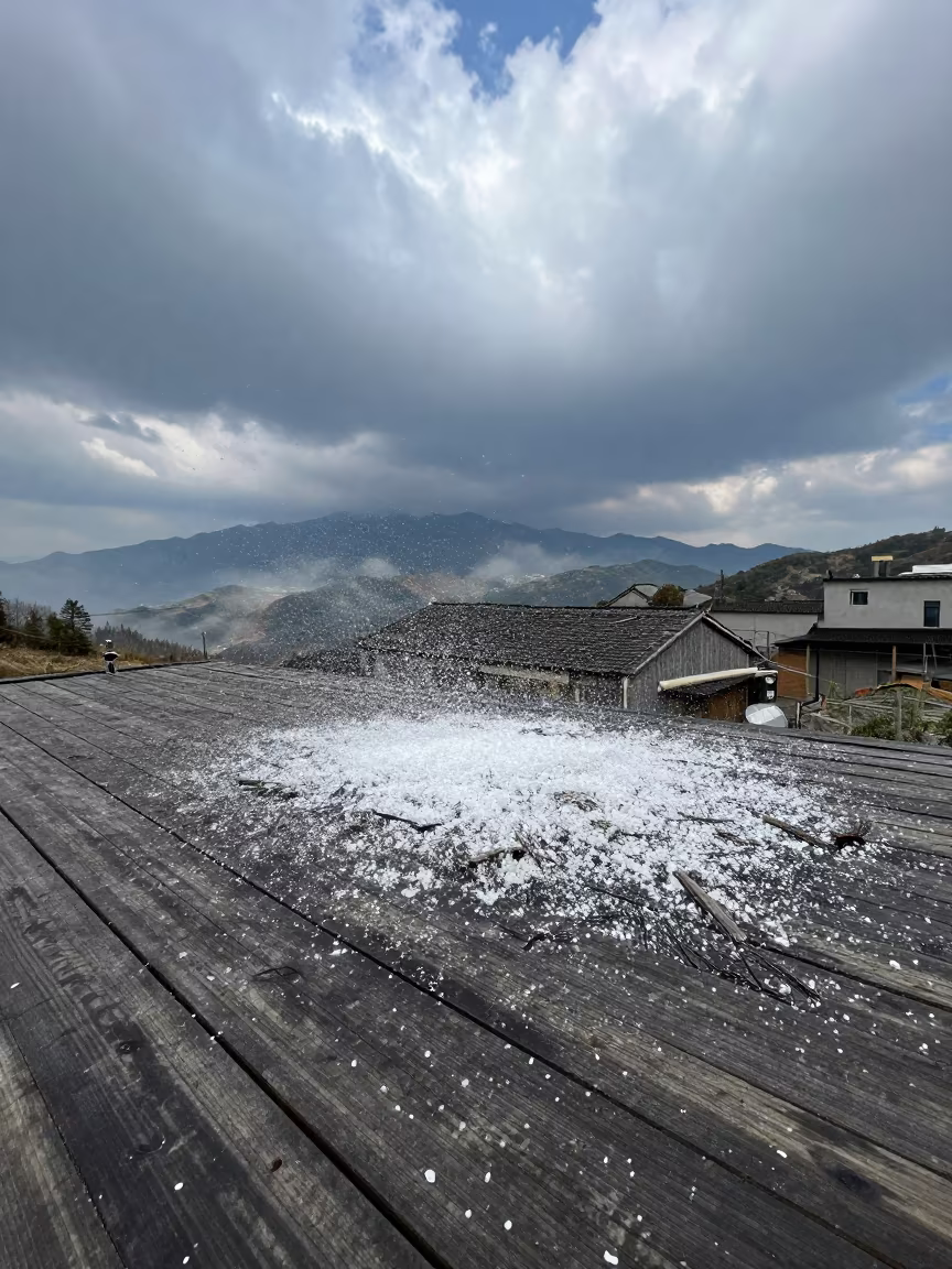 Hail Bouncing on Porch Roof Midday in over a horizon of stacked thunderheads in Zhejiang
