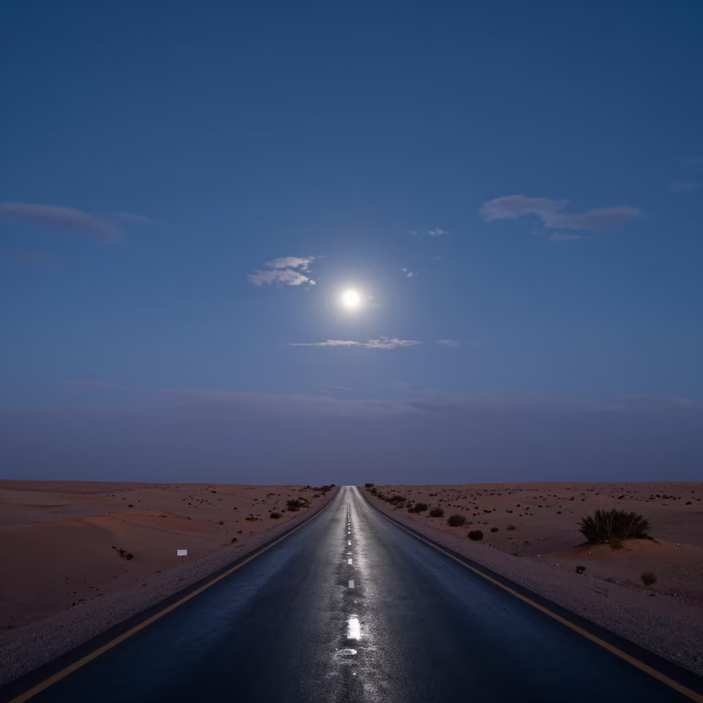 Half Moon Over Desert Highway at Twilight in Tunisia in beneath thin cloud gaps and stars in Tunisia