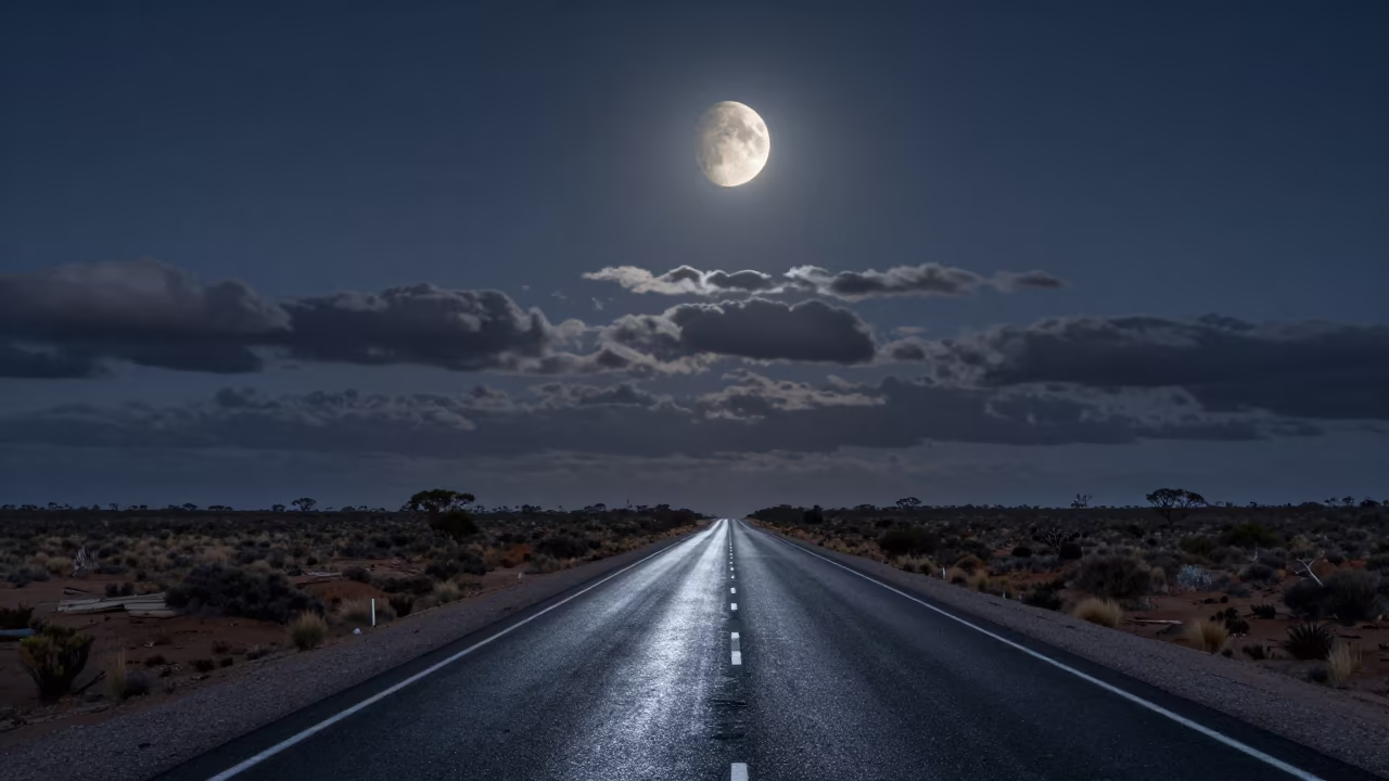 Half Moon Over Desert Highway at Predawn in beneath a dark-sky overlook in Western Australia