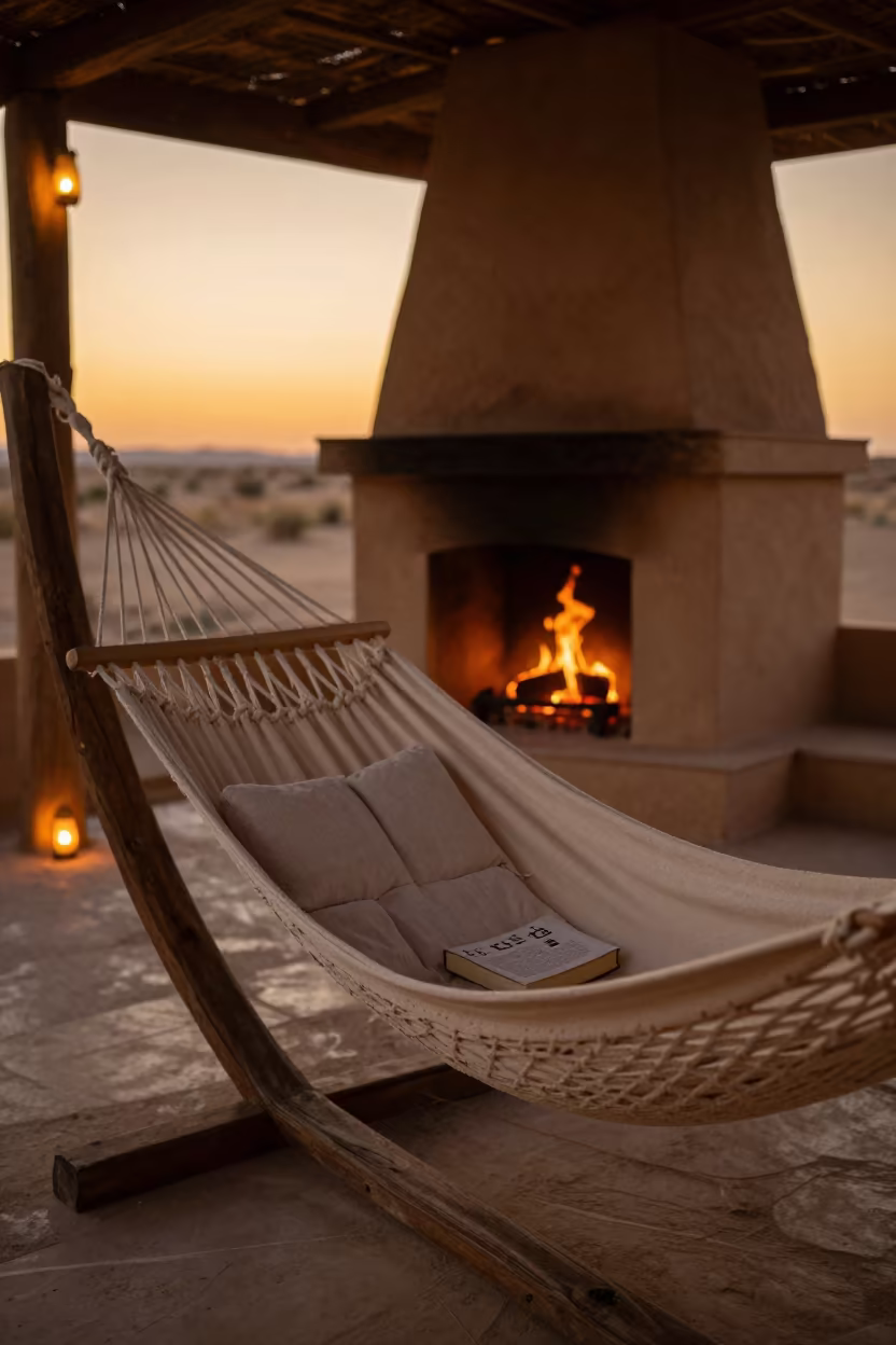 Hammock Book Pillow Fireplace Al-Safira in by a crackling fireplace in Al-Safira