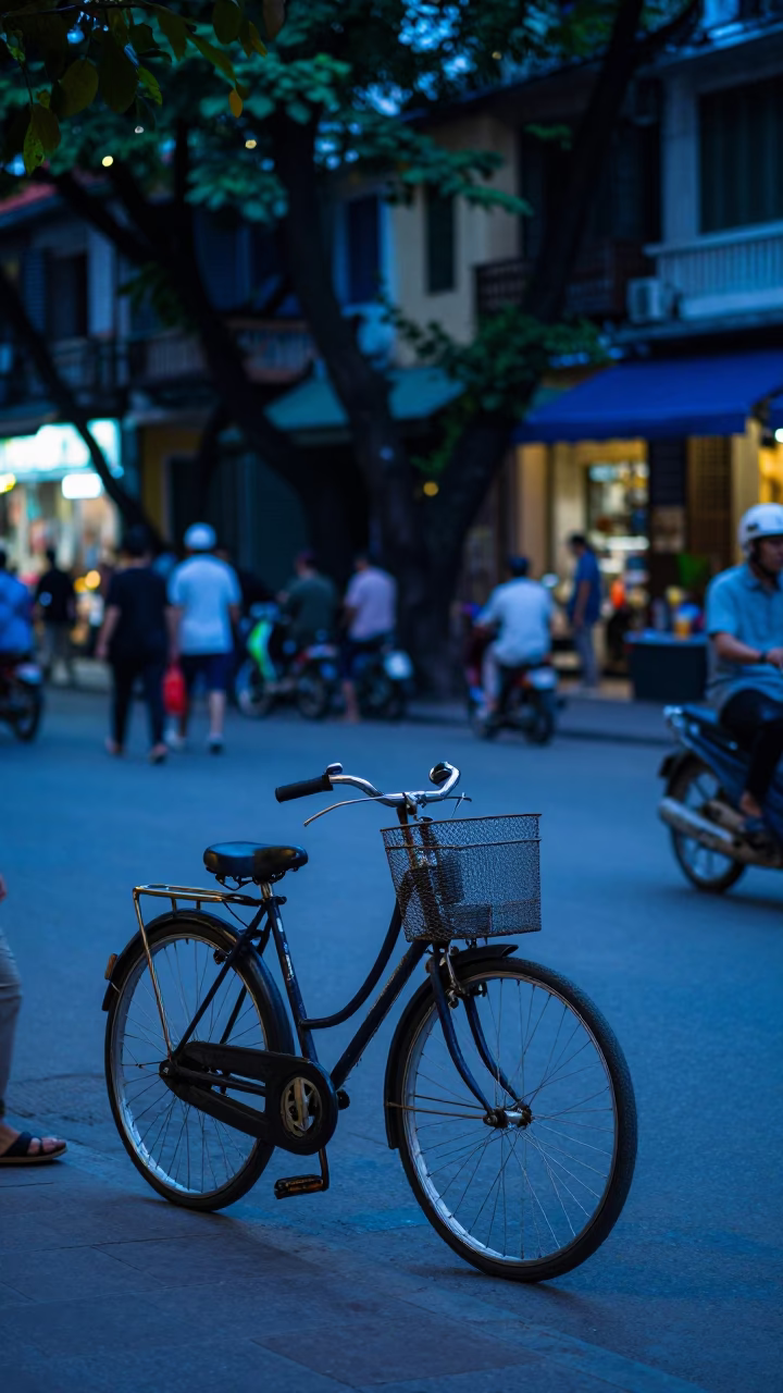 Hanoi Evening Street Scene with Bicycle Basket and Park Bench in Blue Hour in in Hanoi, Vietnam