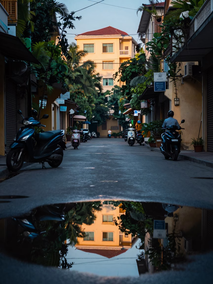Hanoi Vietnam Before Sunrise Street Scene With Puddle Reflections And Wet Pavement in in Hanoi, Vietnam