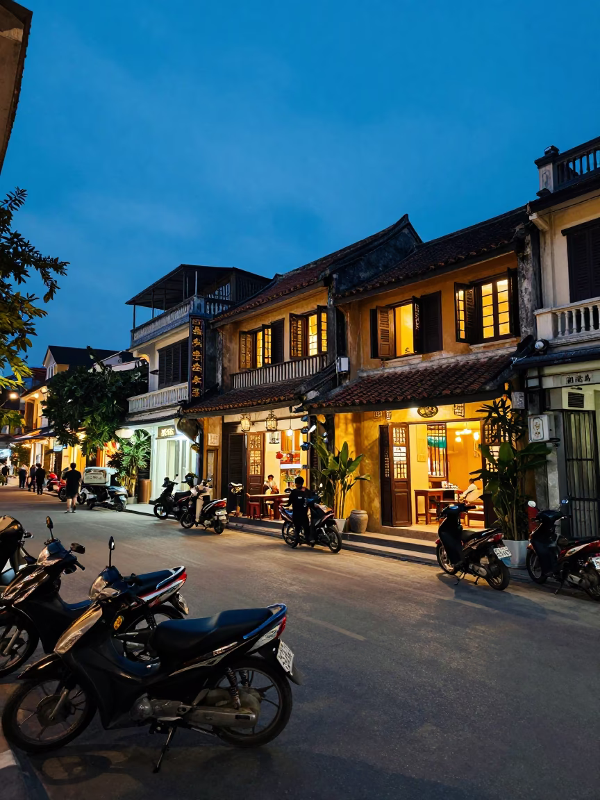 Hanoi Vietnam blue hour street scene with motorbikes and traditional architecture in in Hanoi, Vietnam