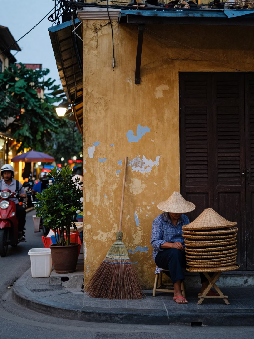 Hanoi Vietnam Early Evening Street Scene with Traditional Broom and Wooden Tray in in Hanoi, Vietnam