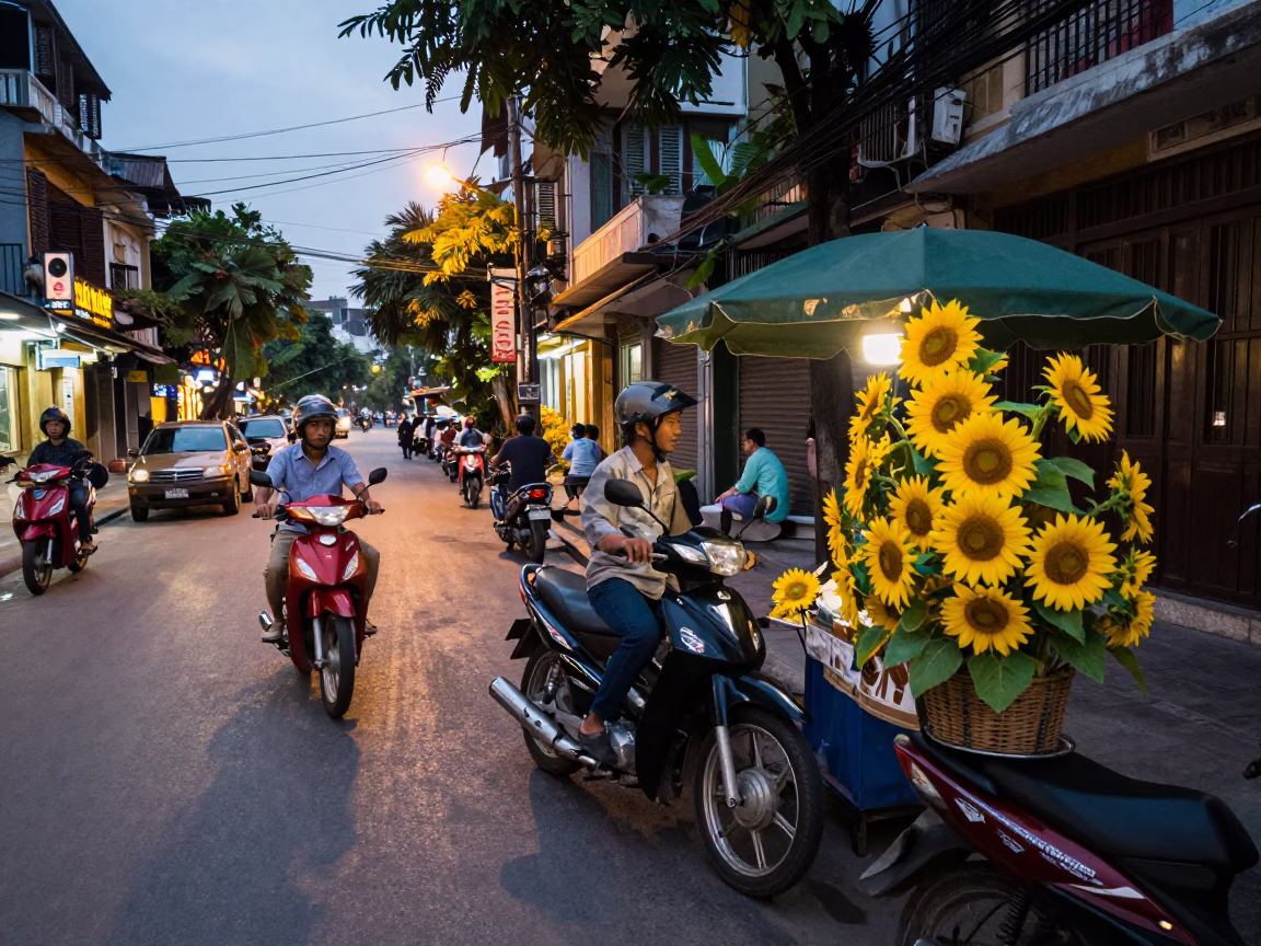 Hanoi Vietnam Evening Street Scene with Motorbikes and Yellow Sunflowers in in Hanoi, Vietnam