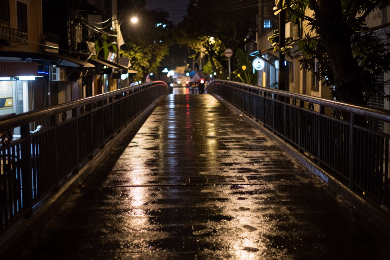 Hanoi Vietnam Night Street Scene Pedestrian Overpass with Wet Footsteps and Monorail Reflection in in Hanoi, Vietnam