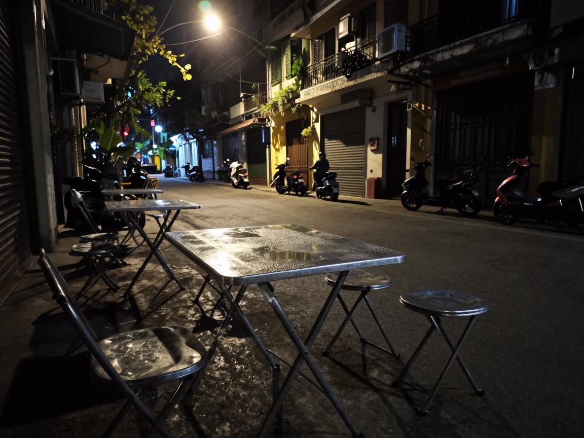 Hanoi Vietnam Night Street Scene with Folding Tables and Condensation in in Hanoi, Vietnam