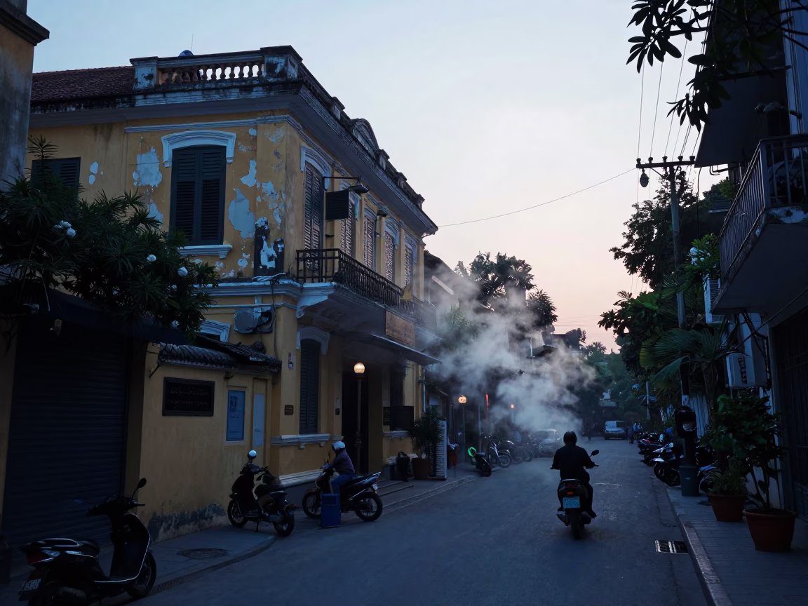 Hanoi Vietnam Pre-Dawn Street Scene with Steam and Morning Routine in in Hanoi, Vietnam