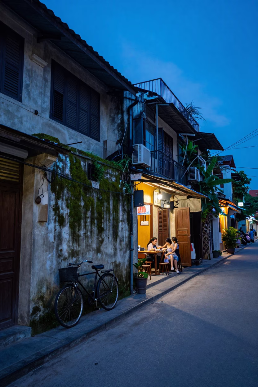Hanoi Vietnam Street Scene at Indigo Twilight with Vintage Bicycle and Urban Life in in Hanoi, Vietnam