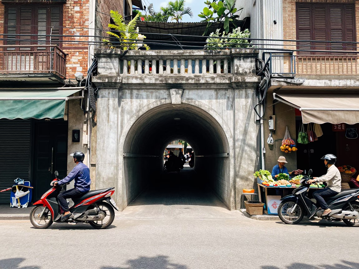 Hanoi Vietnam Street Scene with Concrete Tunnel Portal and Local Market Activity in in Hanoi, Vietnam