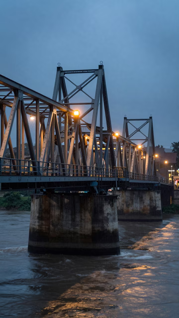 Harar Drawbridge Deck Wet Midnight River Light in beside a bridge pier above moving water in Harar