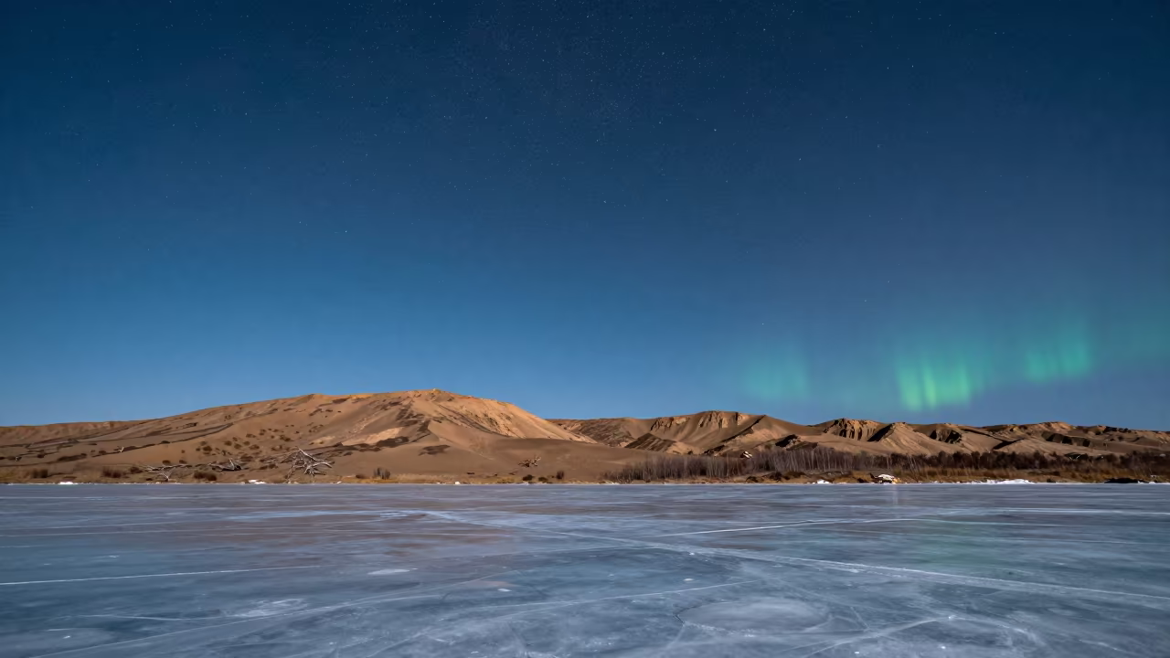 Hard Stars Over Frozen Siberian Reservoir in beneath a wind-cut desert escarpment in Siberia