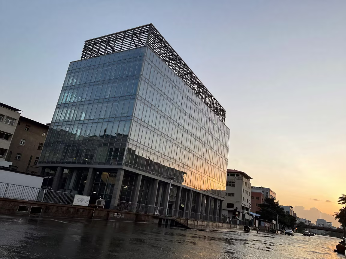Hargeisa Glass Atrium Tower Sunset in beside a canal-front facade in Hargeisa