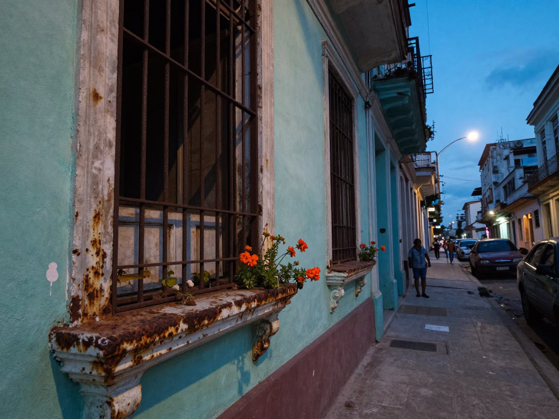 Havana Cuba street scene at dusk with rusted window sills and local evening activity in in Havana, Cuba