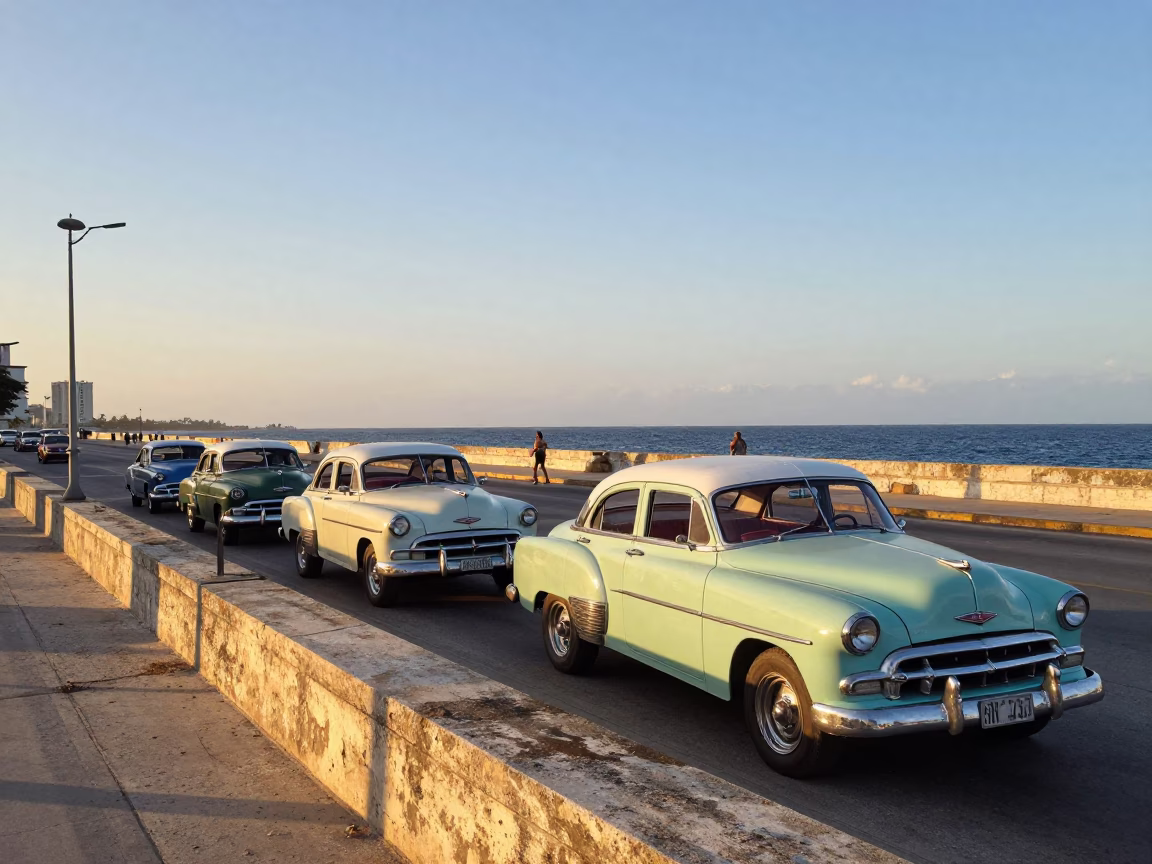 Havana Malecon Sunset View with Vintage American Cars and Tropical Bougainvillea in in Havana, Cuba