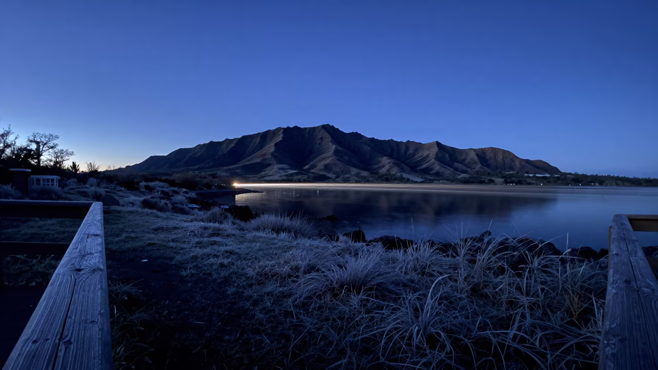 Headlight Trail Along Black Water at Blue Hour in from a frost-hushed ridgeline in Hawaii