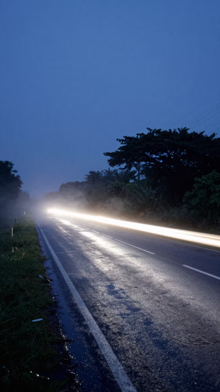 Headlight Trail and Drifting Smoke Under Dawn Sky in under the clearest stretch of sky in Equatorial Guinea