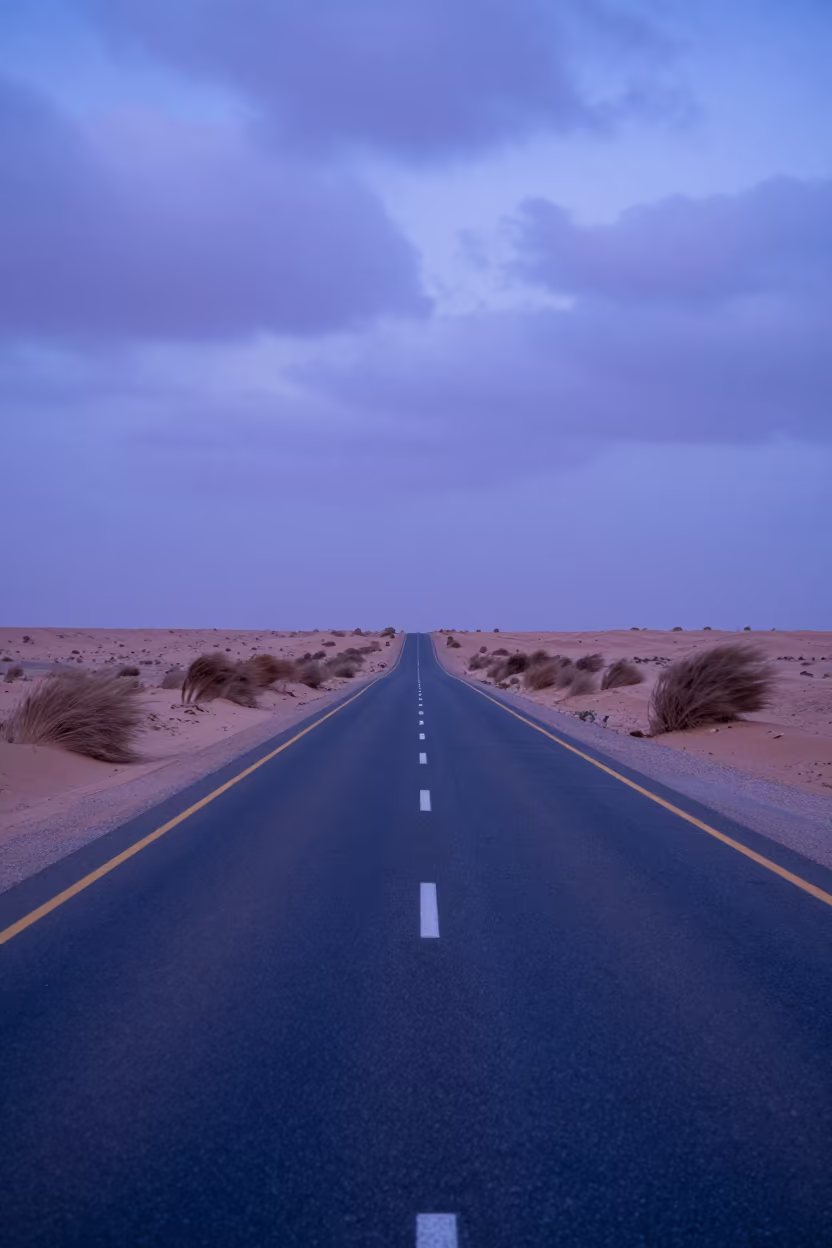 Heat Haze Shimmering Above Desert Highway at Twilight in beneath fast-moving cloud bands near Muscat