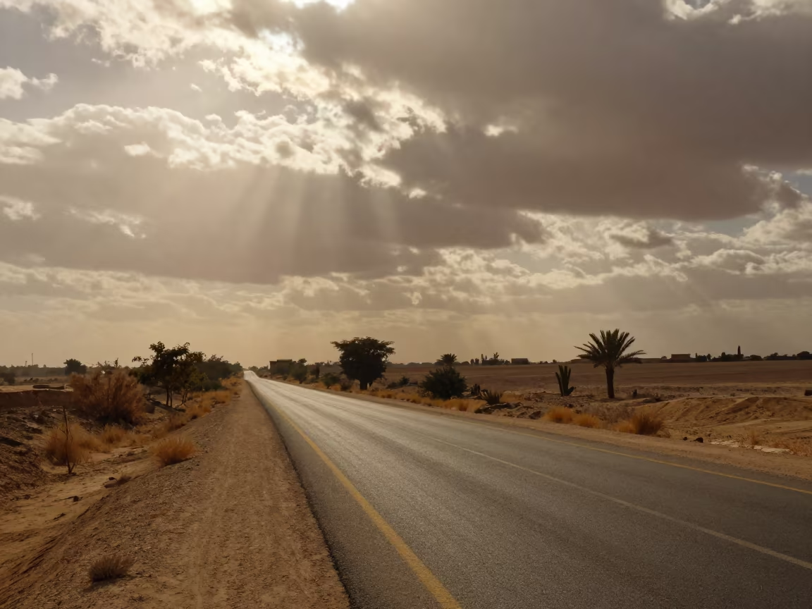 Heat Shimmer Distorting Desert Road Near Cairo in beneath fast-moving cloud bands near Islamic Cairo, Cairo