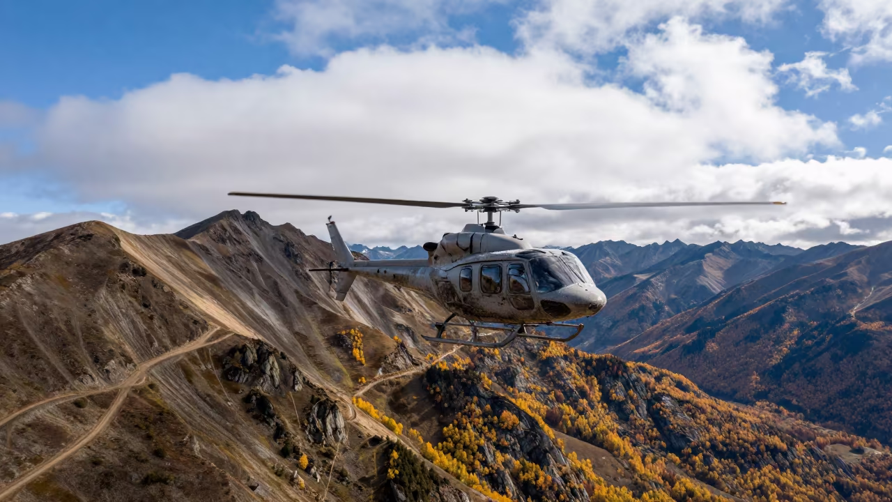 Helicopter Crossing Alpine Saddle Under Stacked Clouds in along a switchback approach in Canada