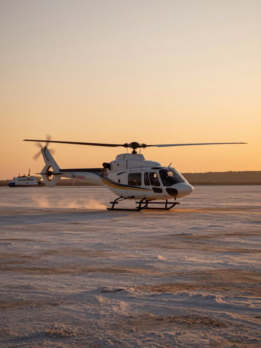 Helicopter Over Salt Flats in Amber Sunset in across a remote ferry crossing near Latakia