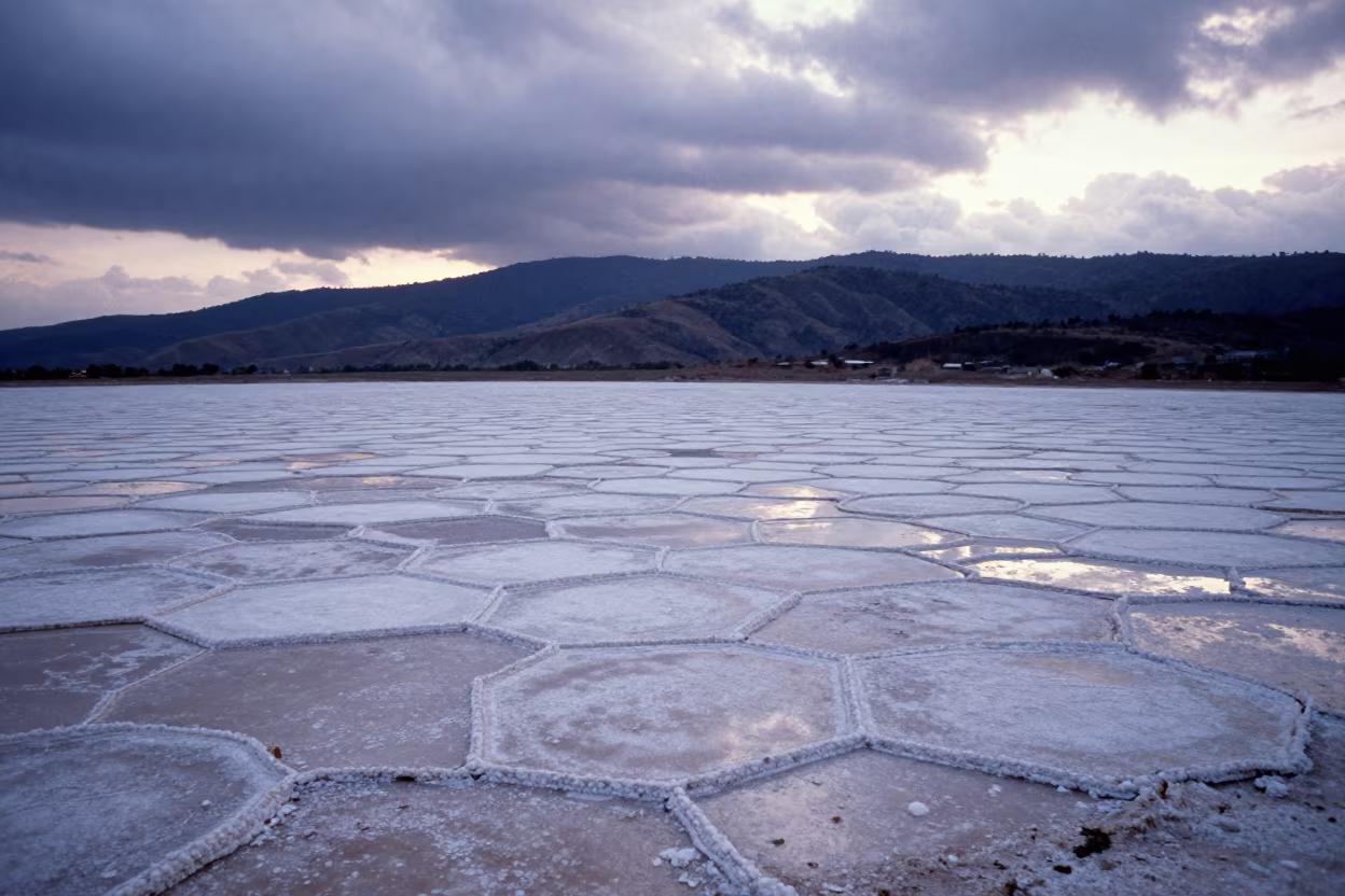 Hexagonal Salt Crystals at Dawn in El Salvador in from a ridge above layered foothills in El Salvador
