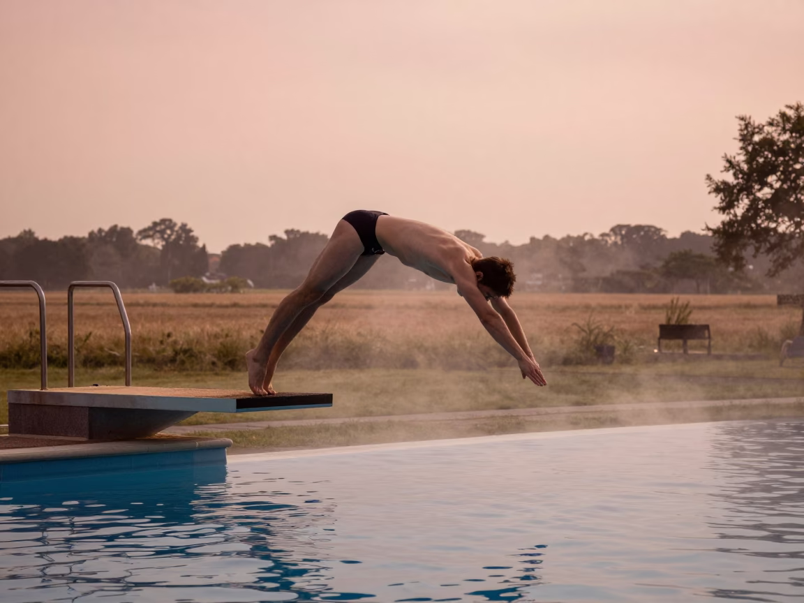High Diver in Pike Pose Above Pool at Dusk in near open fields near Utrecht