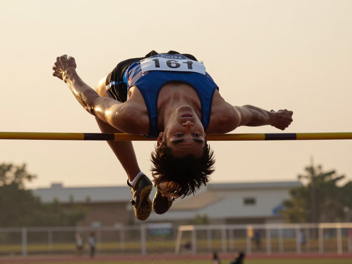 High Jumper Arching Over Bar at Mumbai Harbor Sunset in at a harbor quay near Mumbai