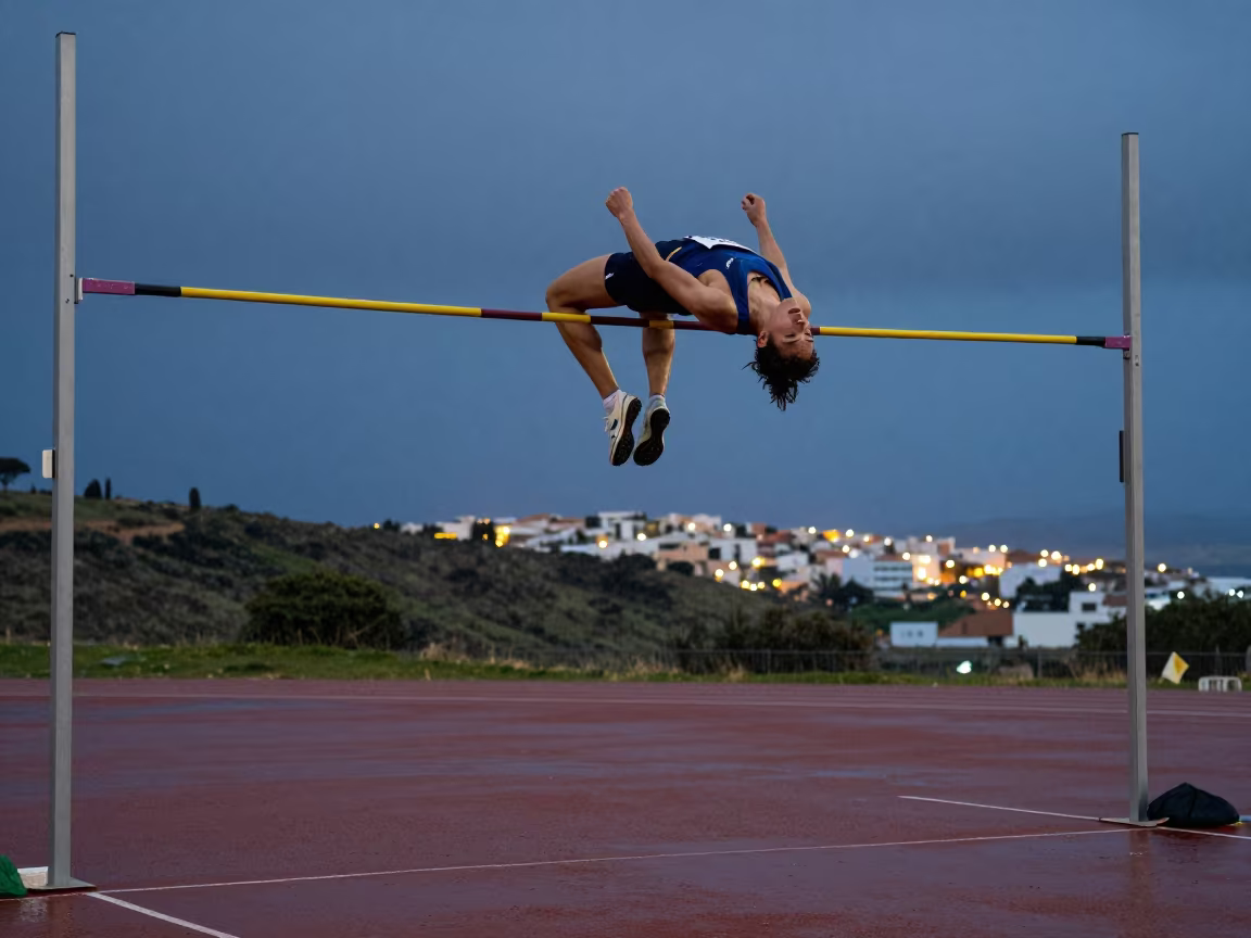 High Jumper Arching Over Bar at Twilight in Essaouira in on a hillside near Essaouira