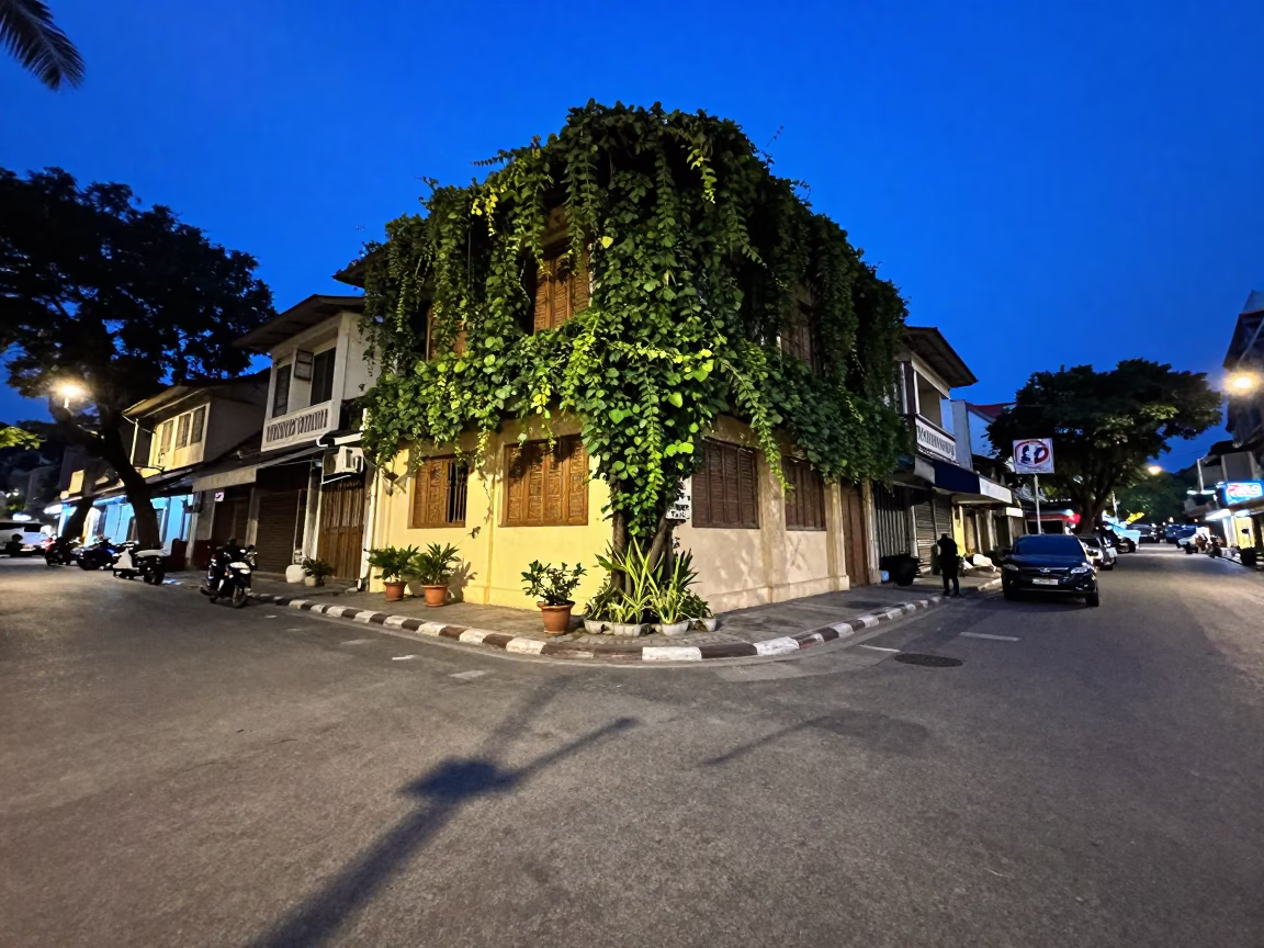 Ho Chi Minh City street corner evening scene with ivy and local life in in Ho Chi Minh City, Vietnam