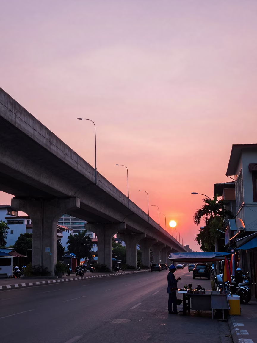 Ho Chi Minh City Sunset Street Scene with Highway Flyover and Local Vendor in in Ho Chi Minh City, Vietnam