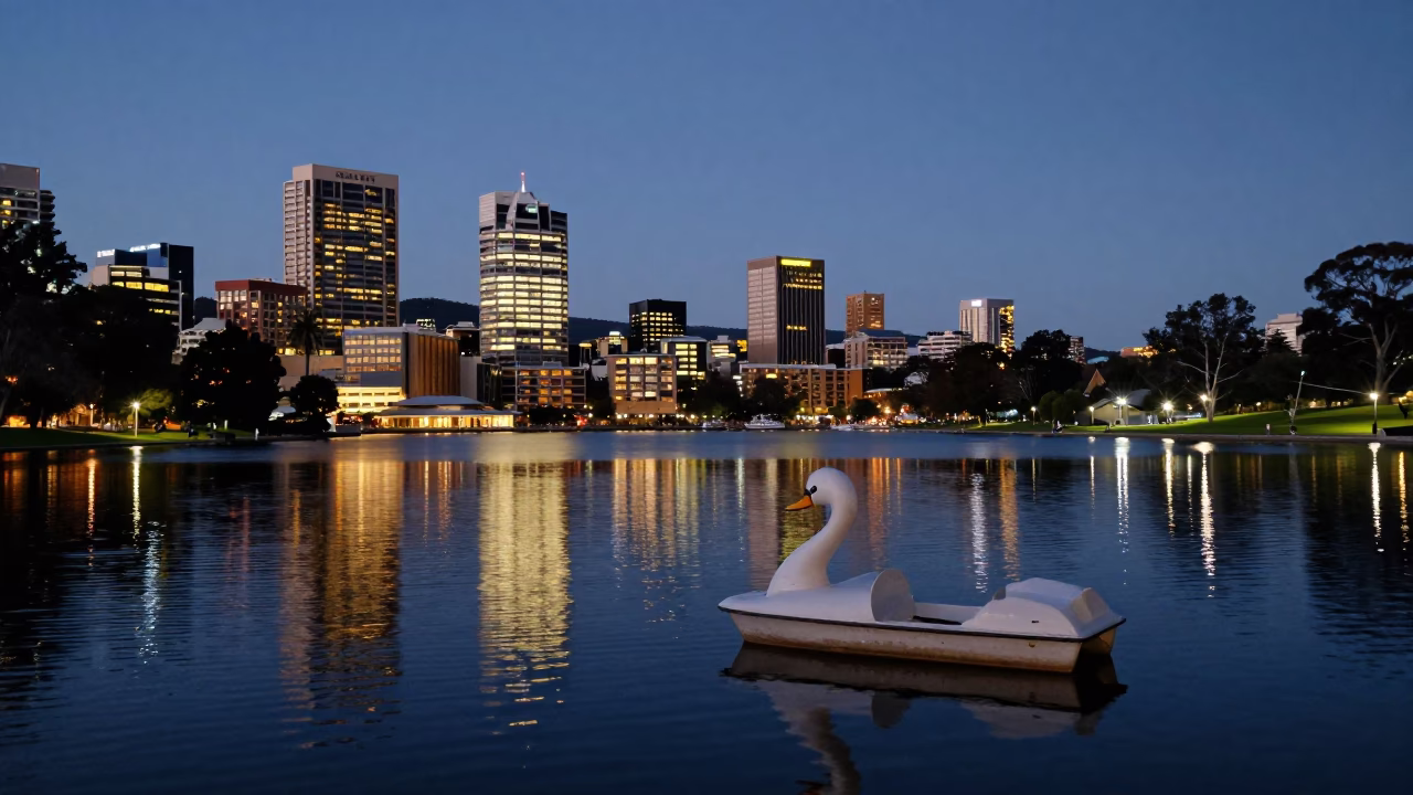 Hobart Tasmania City Lights Glow Over Waterfront and Park Lake at Dusk in in Hobart, Tasmania, Australia