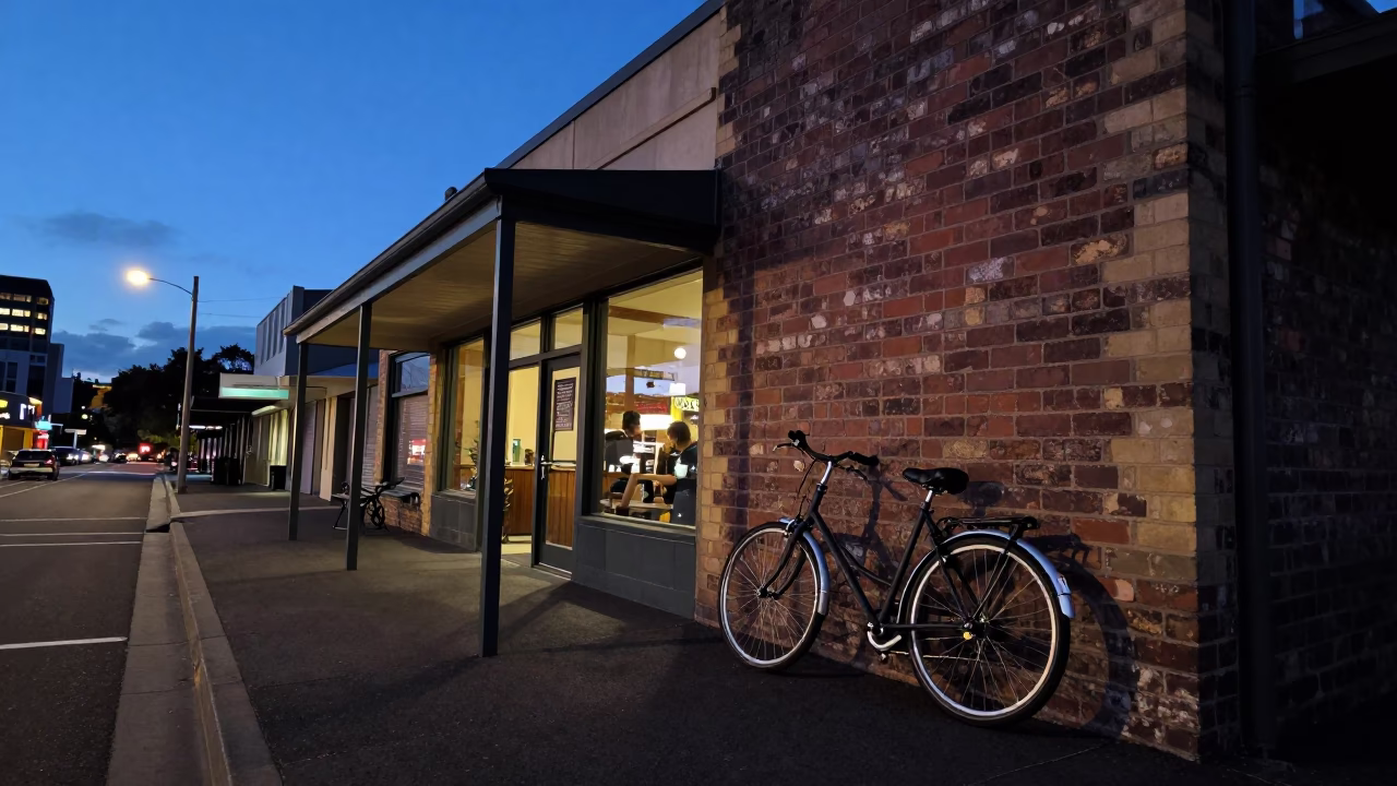 Hobart Tasmania indigo twilight street scene with bicycle leaning against cafe exterior in in Hobart, Tasmania, Australia