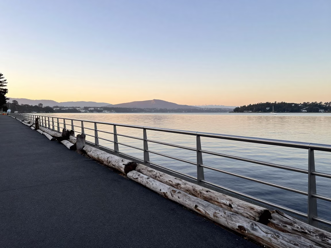 Hobart Tasmania waterfront at dawn with driftwood and steel railing in in Hobart, Tasmania, Australia