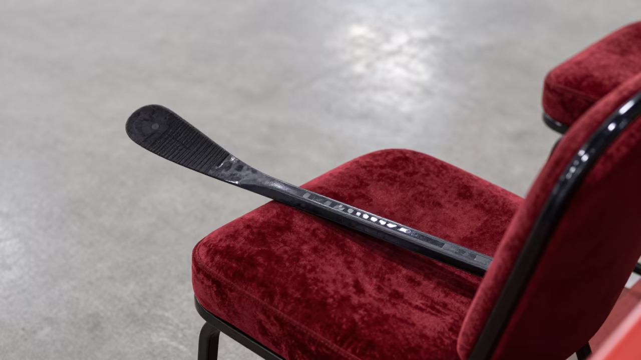 Hockey Stick Rack on Velvet Chair in on a velvet chair in Kelowna
