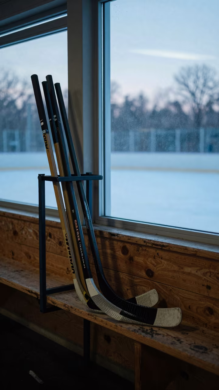 Hockey Stick Rack in Winter Rink Light in on a wooden workbench near Tangier