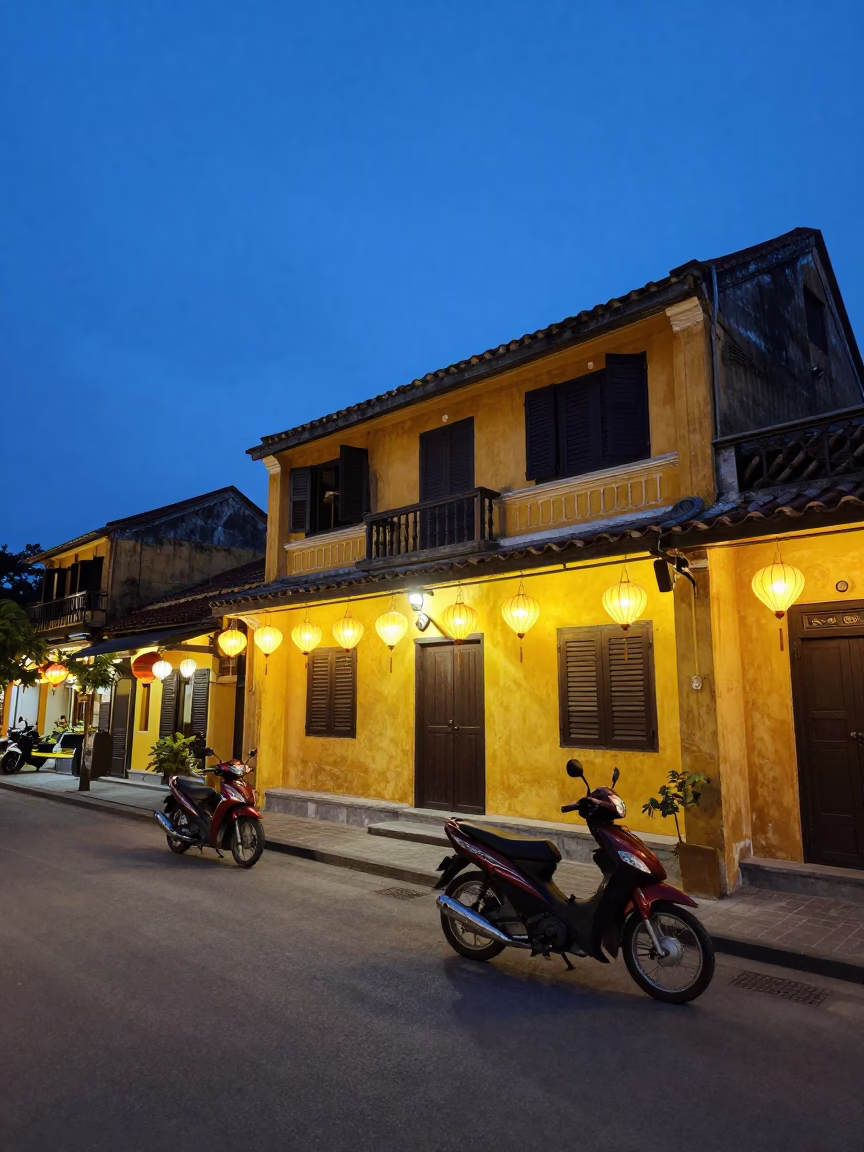 Hoi An Vietnam Blue Hour Street Scene with Lanterns and Motorbikes in in Hoi An, Vietnam