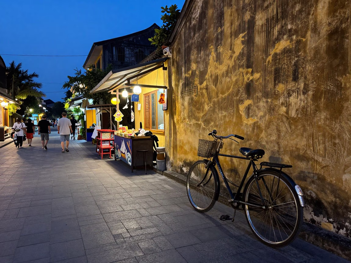 Hoi An Vietnam Early Evening Street Scene with Vintage Bicycle and Local Food Vendor in in Hoi An, Vietnam