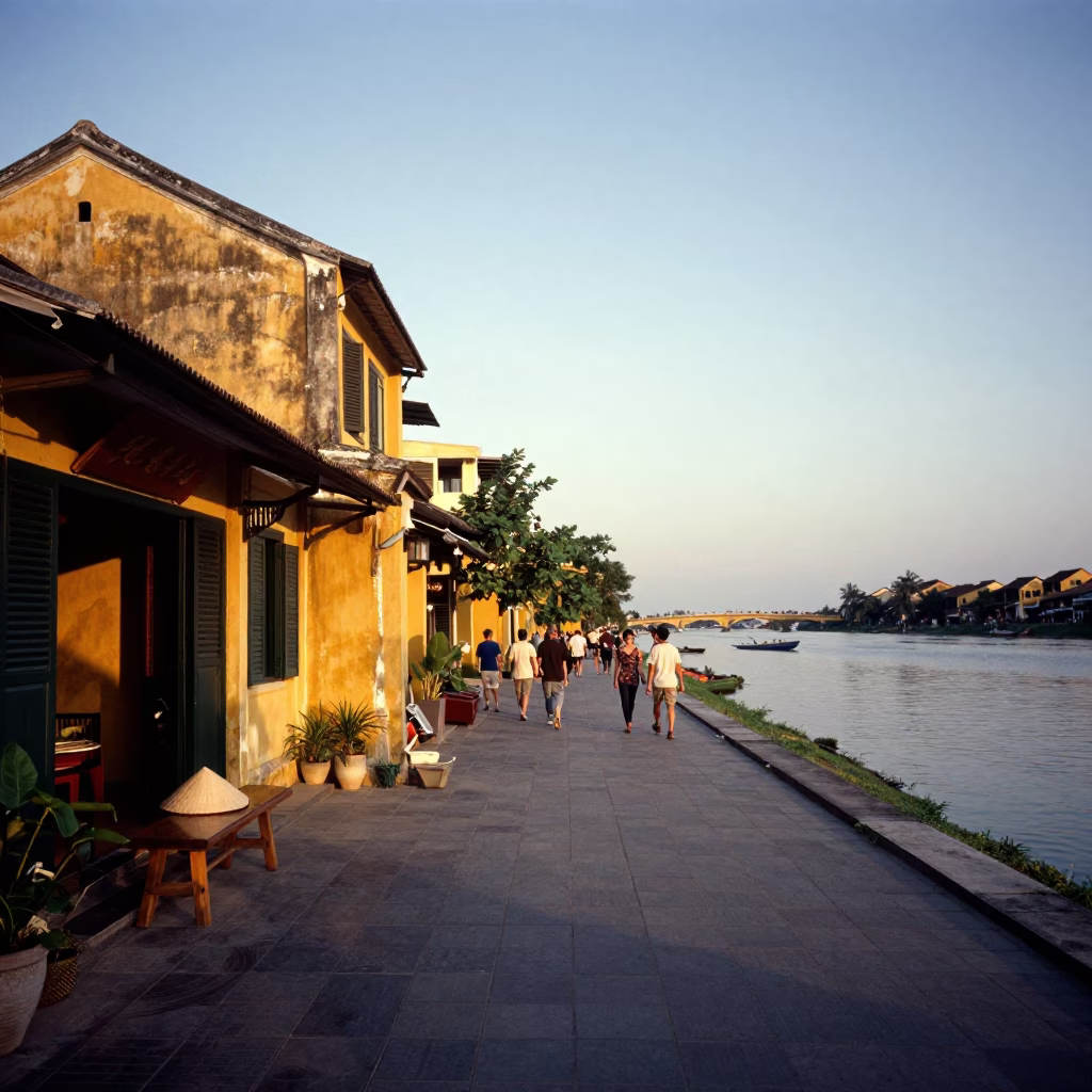 Hoi An Vietnam Evening Street Scene with Yellow Facades and River Activity in in Hoi An, Vietnam