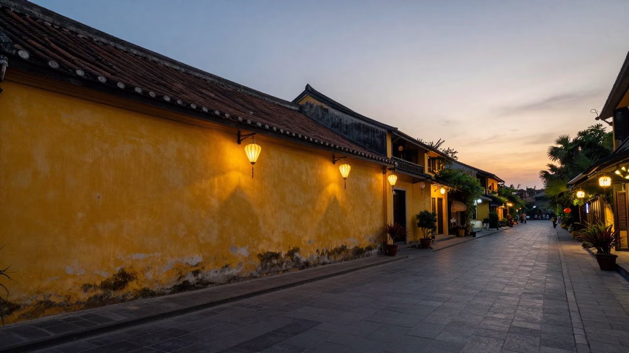 Hoi An Vietnam Evening Street Scene with Yellow Walls and Lanterns at Sunset in in Hoi An, Vietnam