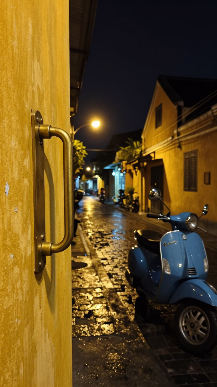 Hoi An Vietnam Night Street Scene with Brass Hardware and Vespa Reflections in in Hoi An, Vietnam