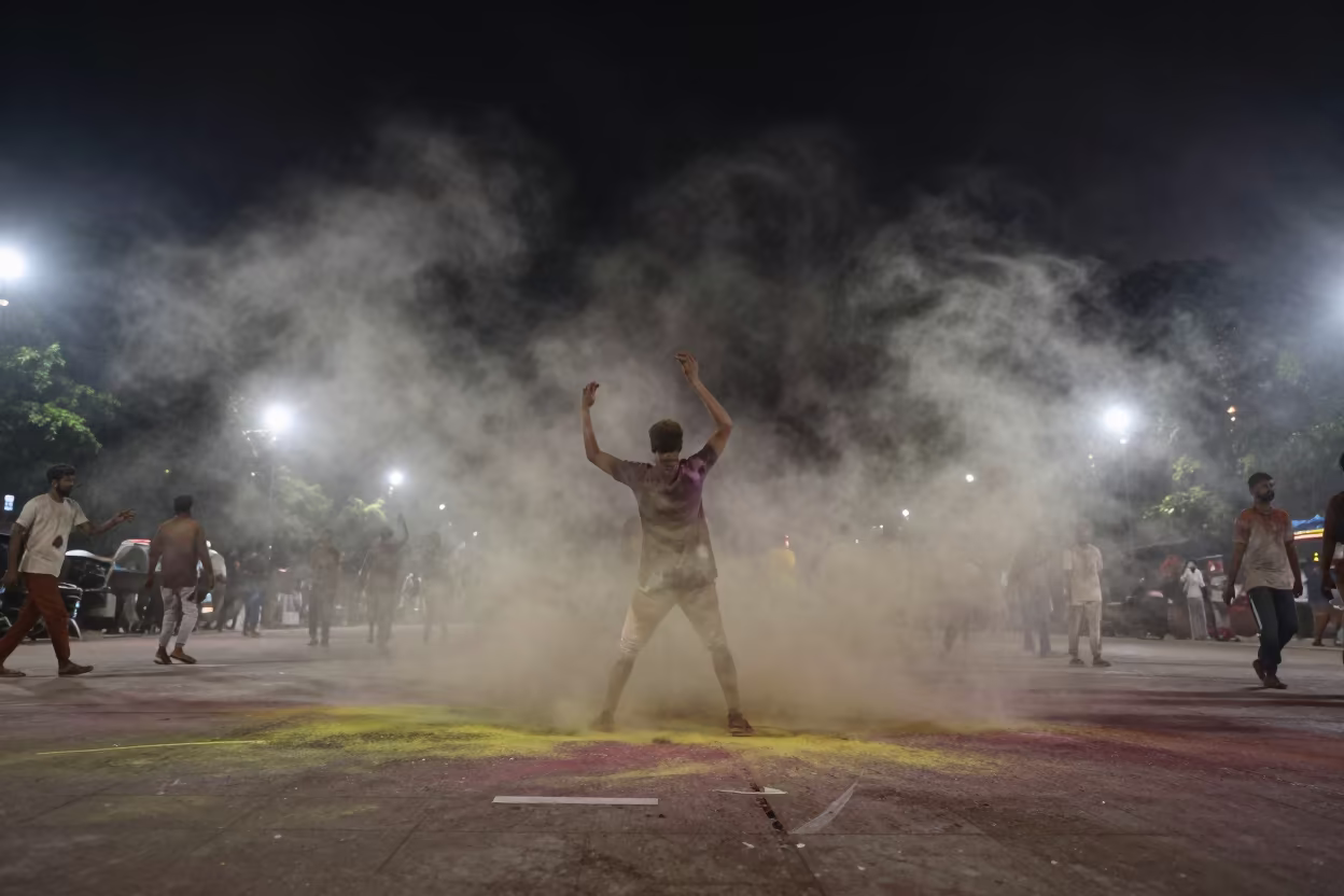 Holi Festival Colored Powder Cloud at Night in at a public square during a festival near Kolkata