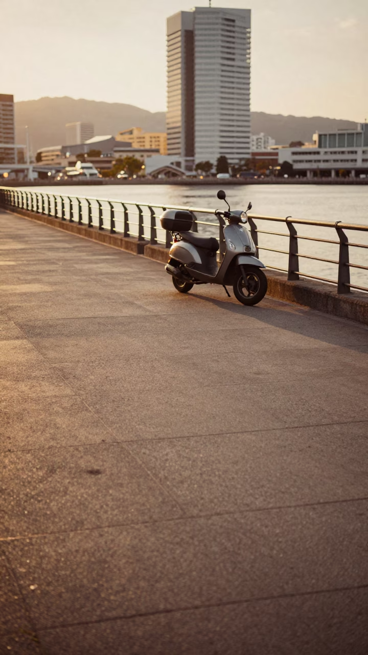 Honeyed Evening Light on Fukuoka Harbor Promenade Scooter and City Skyline in in Fukuoka, Japan