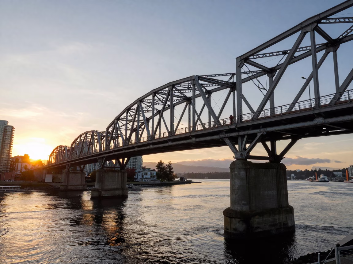 Honeyed Evening Light on Granville Street Bridge Maintenance Cradle Over Fraser River in in Vancouver, British Columbia, Canada