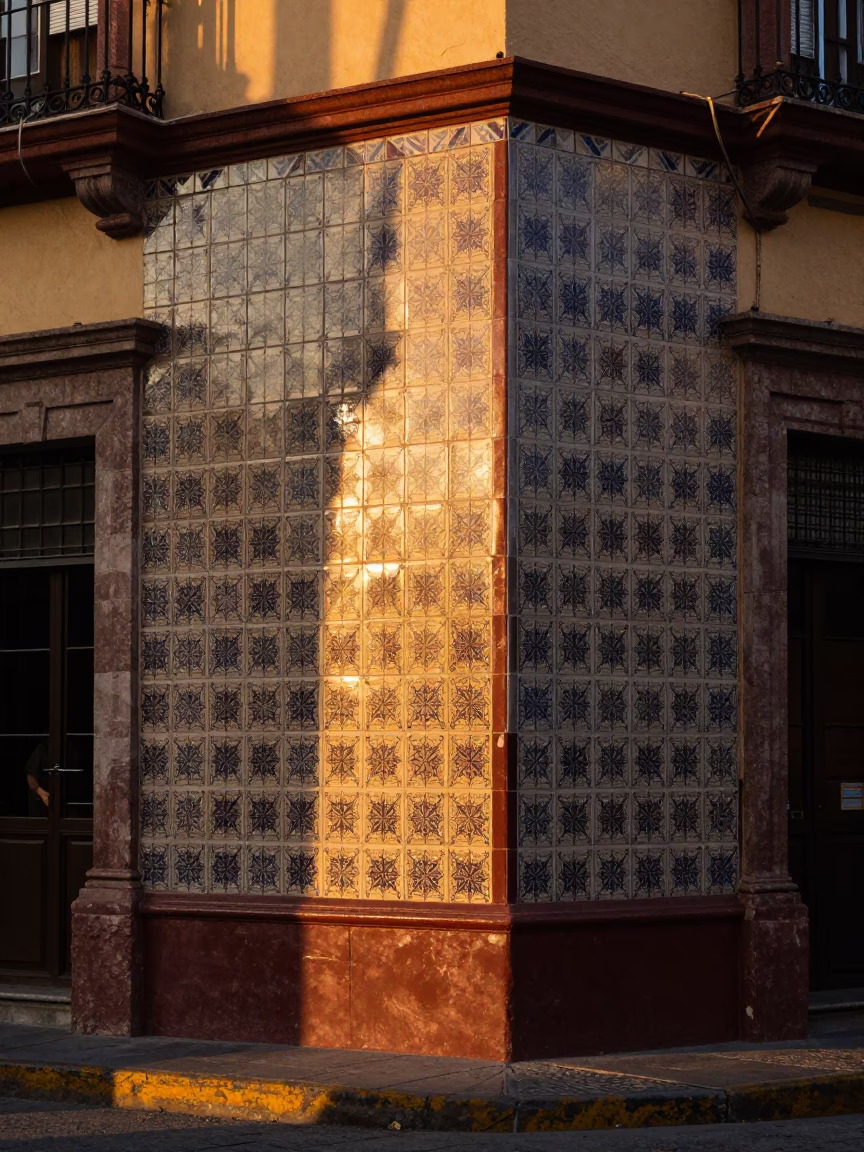 Honeyed Evening Light on Guadalajara Tile Street Corner with Sun Stripe in in Guadalajara, Mexico