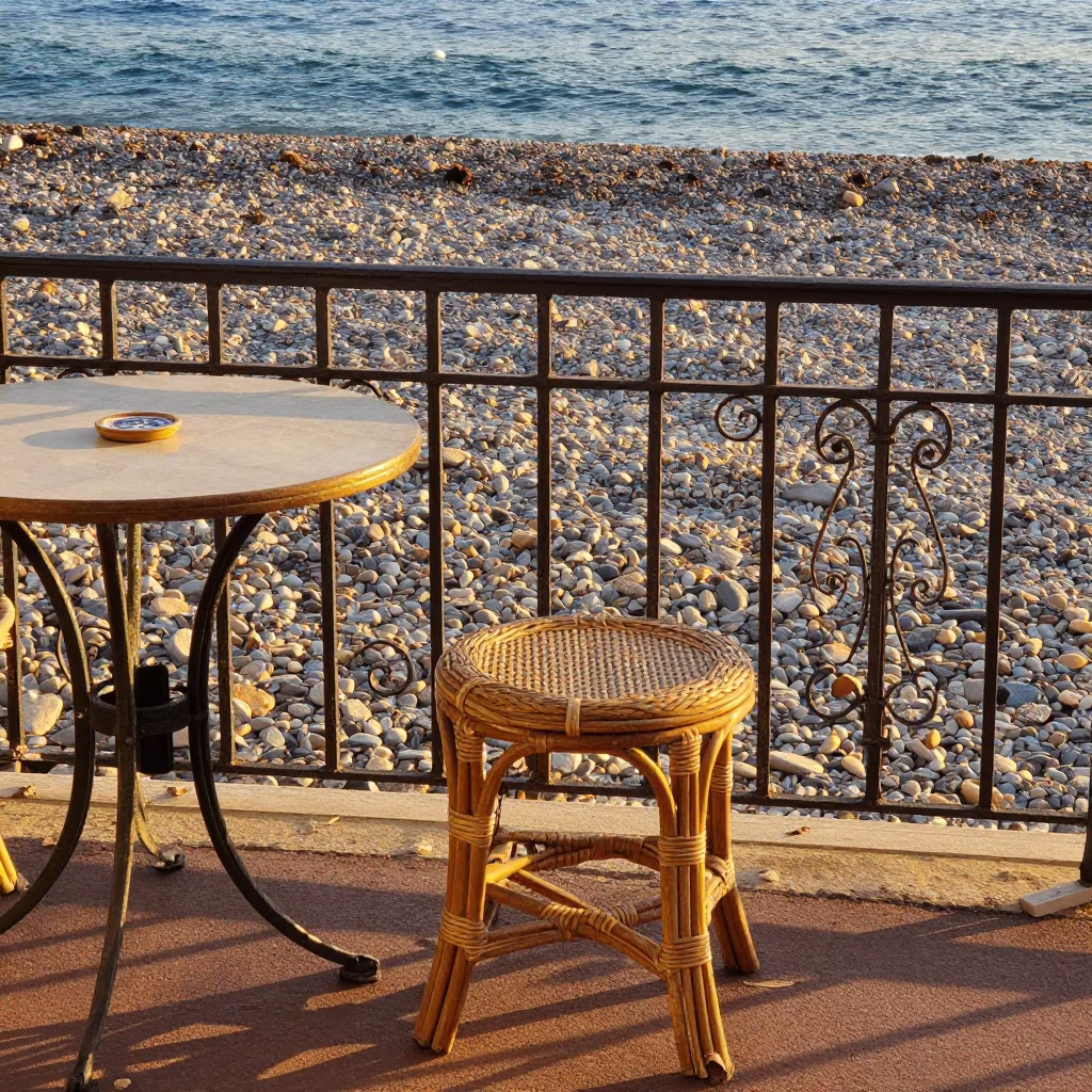 Honeyed Evening Light on Nice France Promenade with Rattan Stool and Cobblestone Street Scene in in Nice, France