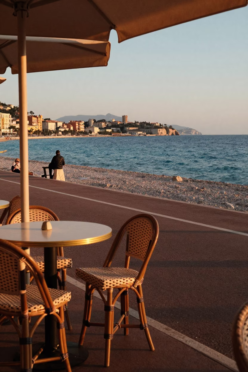 Honeyed Evening Light on Nice Promenade with Rattan Stool and Jacaranda Bloom in in Nice, France