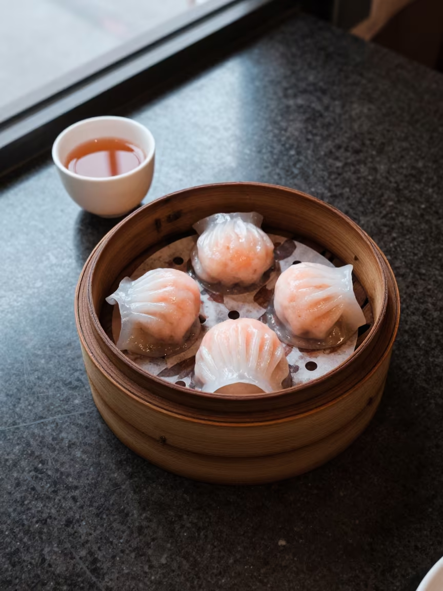 Hong Kong Dim Sum Tray and Tea in at a coffee bar counter in Hong Kong