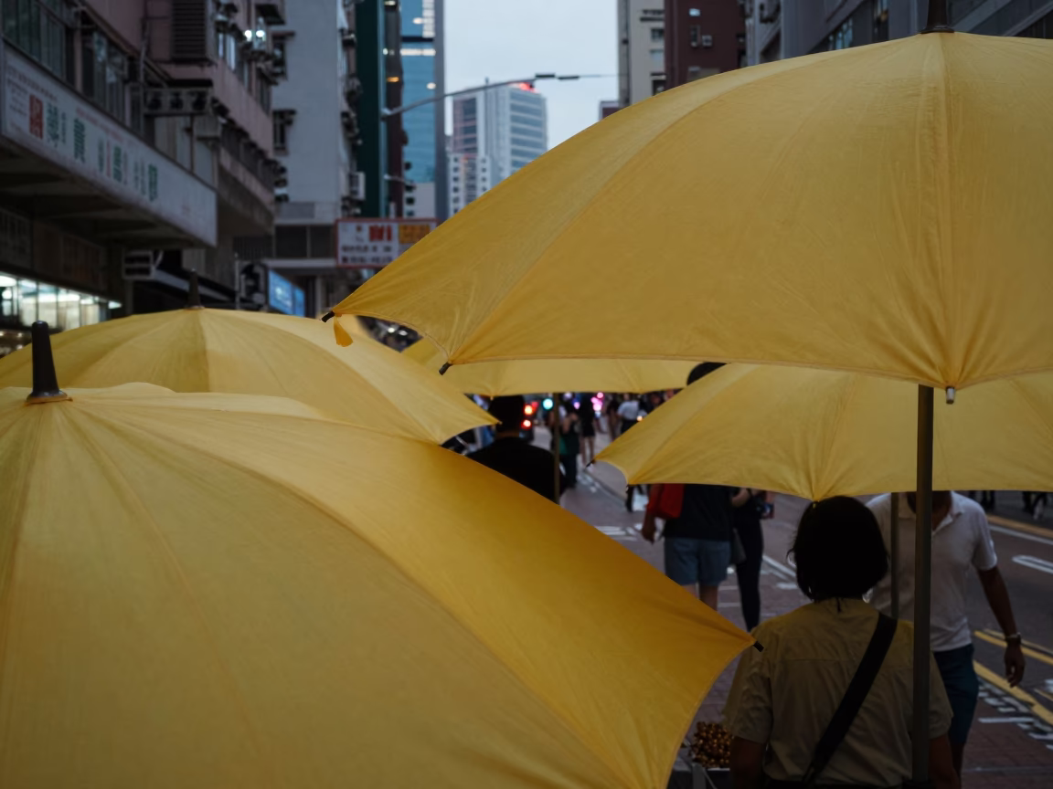 Hong Kong Early Evening Street Scene with Yellow Umbrellas and Traditional Architecture in in Hong Kong, Hong Kong